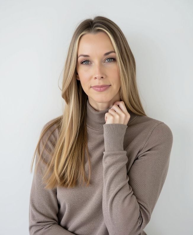 Casey Byrus in a tan sweater